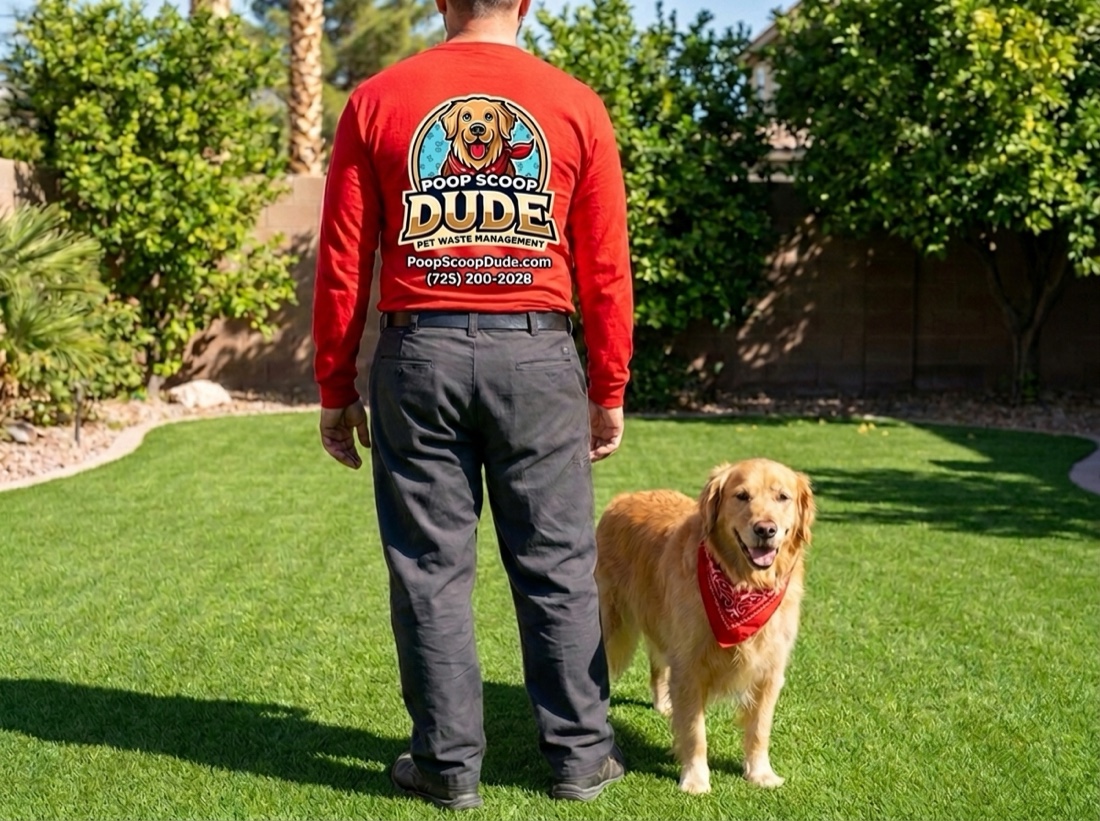 Poop Scoop Dude in a branded shirt with a happy golden retriever in a clean Las Vegas backyard